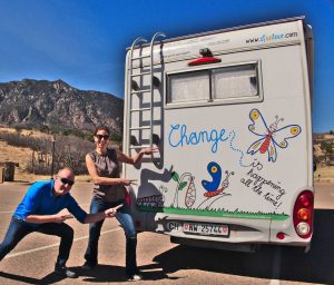Elfie Czerny and Dominik Godat in front of Hearty - the motorhome of Elfie Czerny & Dominik Godat hosts of the solution-focused Simply Focus Podcast